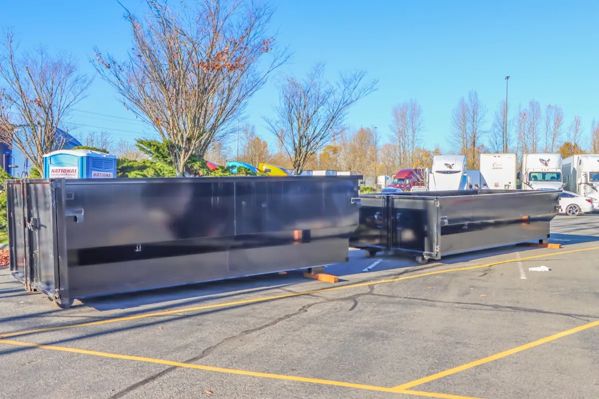 Professional dumpster rental service with roll-off container on residential driveway in Upper Dublin